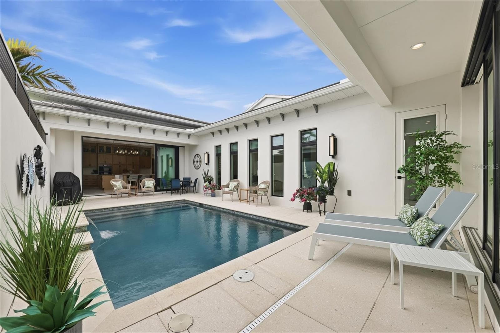 View of Pool from Primary Bedroom - 5931 CAT CLAW LN, BRADENTON