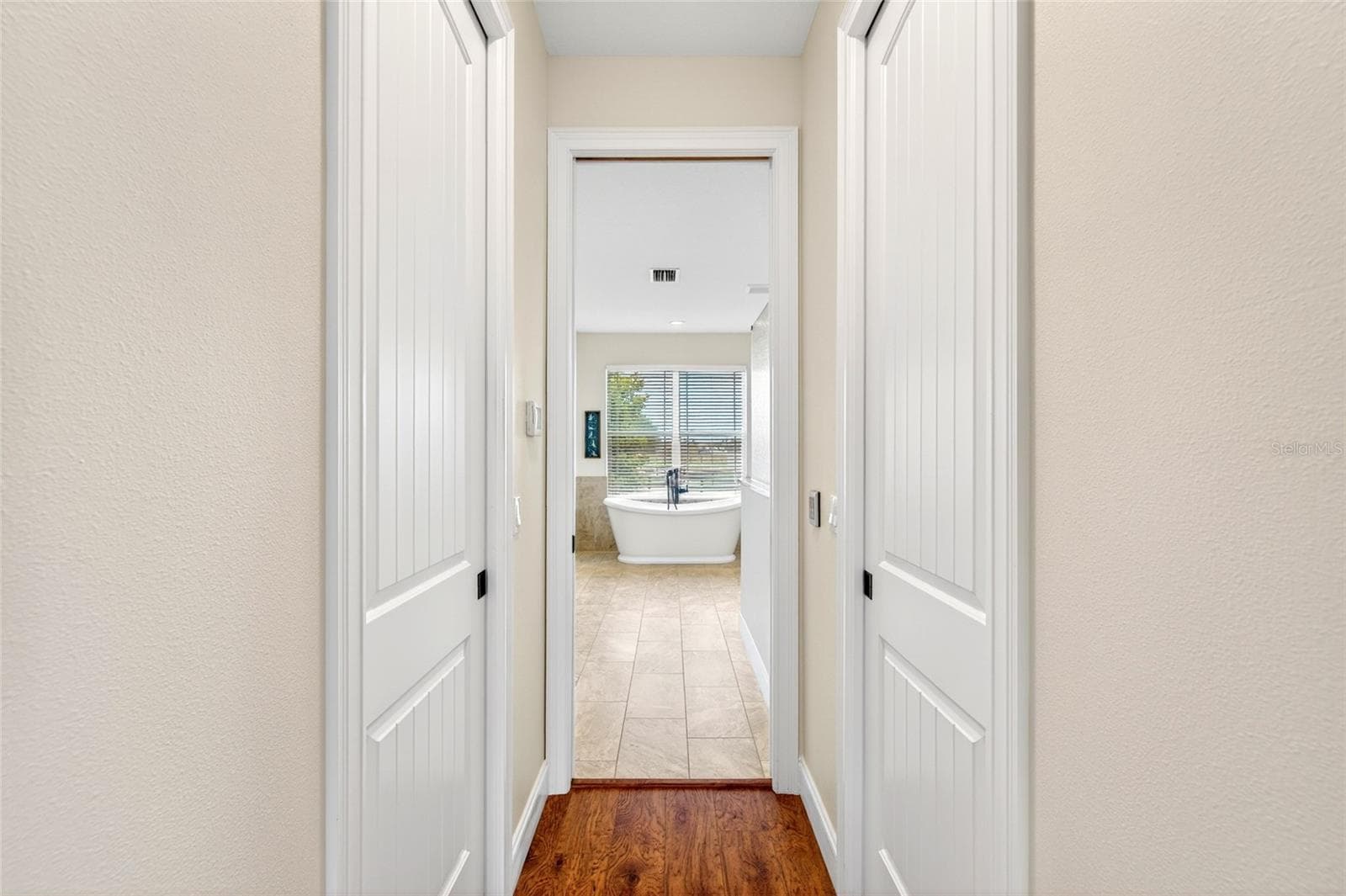 Hall to primary bath - 5178 SW 93RD LN, OCALA