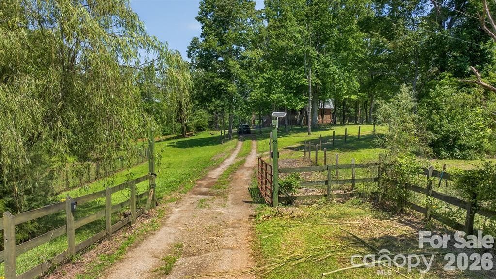 Drive in. This property offers a perfect blend of privacy and accessibility. - Mill Spring