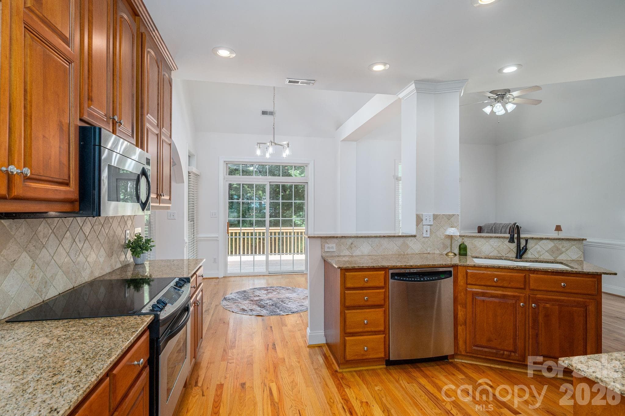 Kitchen open to entertaining area and deck. - 4017 Foxes Trail, Cramerton