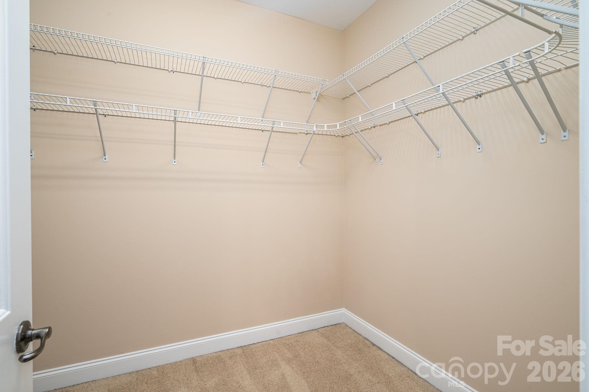 Large walk in Primary bedroom closet. - 4017 Foxes Trail, Cramerton