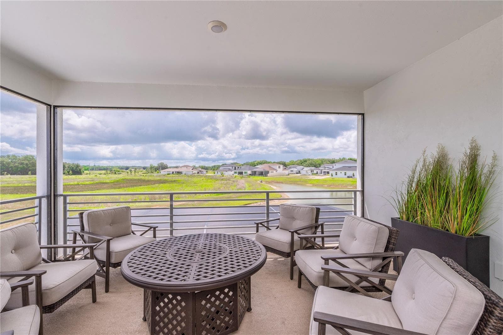 Upstairs screen balcony overlooking the water view. - 10706 TORCHWOOD SEA WAY, SAN ANTONIO