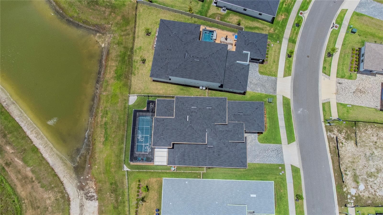 Aerial view of the home and water view. - 10706 TORCHWOOD SEA WAY, SAN ANTONIO