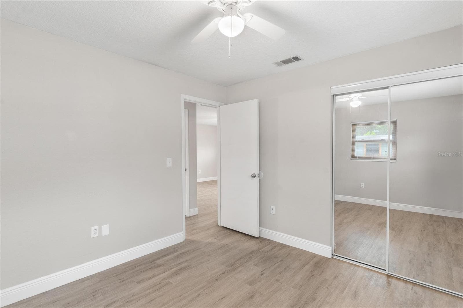 Bedroom 2 with Decorative Mirrored Closet Door - 35904 DAWN DR, LEESBURG