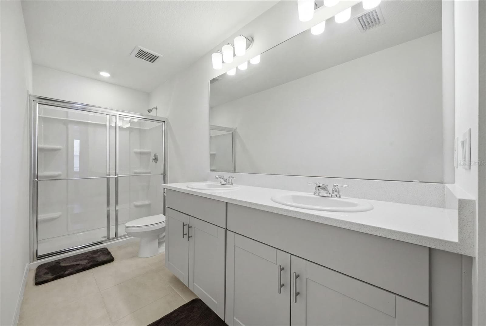 Primary Bathroom with Dual Sinks and Walk-In Shower - 16570 SAN NICOLA PL, BRADENTON