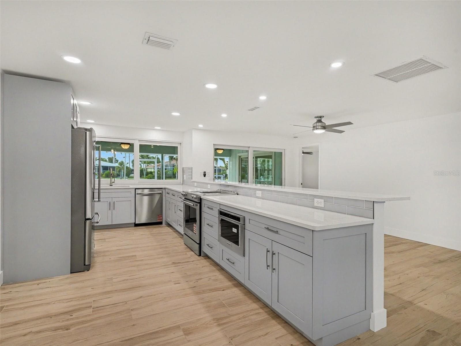 Enjoy your brand new kitchen overlooking the waterfront and lanai/pool area. - 548 BELVEDERE CT, PUNTA GORDA