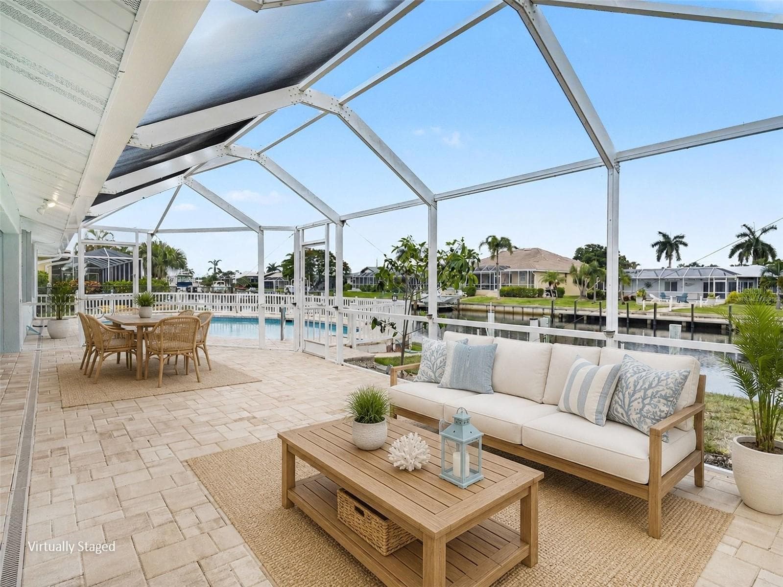 Back lanai virtually staged for outdoor entertaining - 548 BELVEDERE CT, PUNTA GORDA