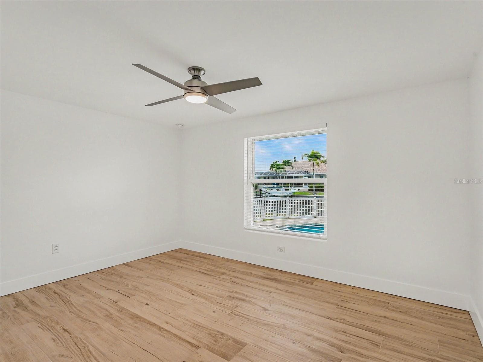 Third bedroom at the back of home overlooking the pool area - 548 BELVEDERE CT, PUNTA GORDA
