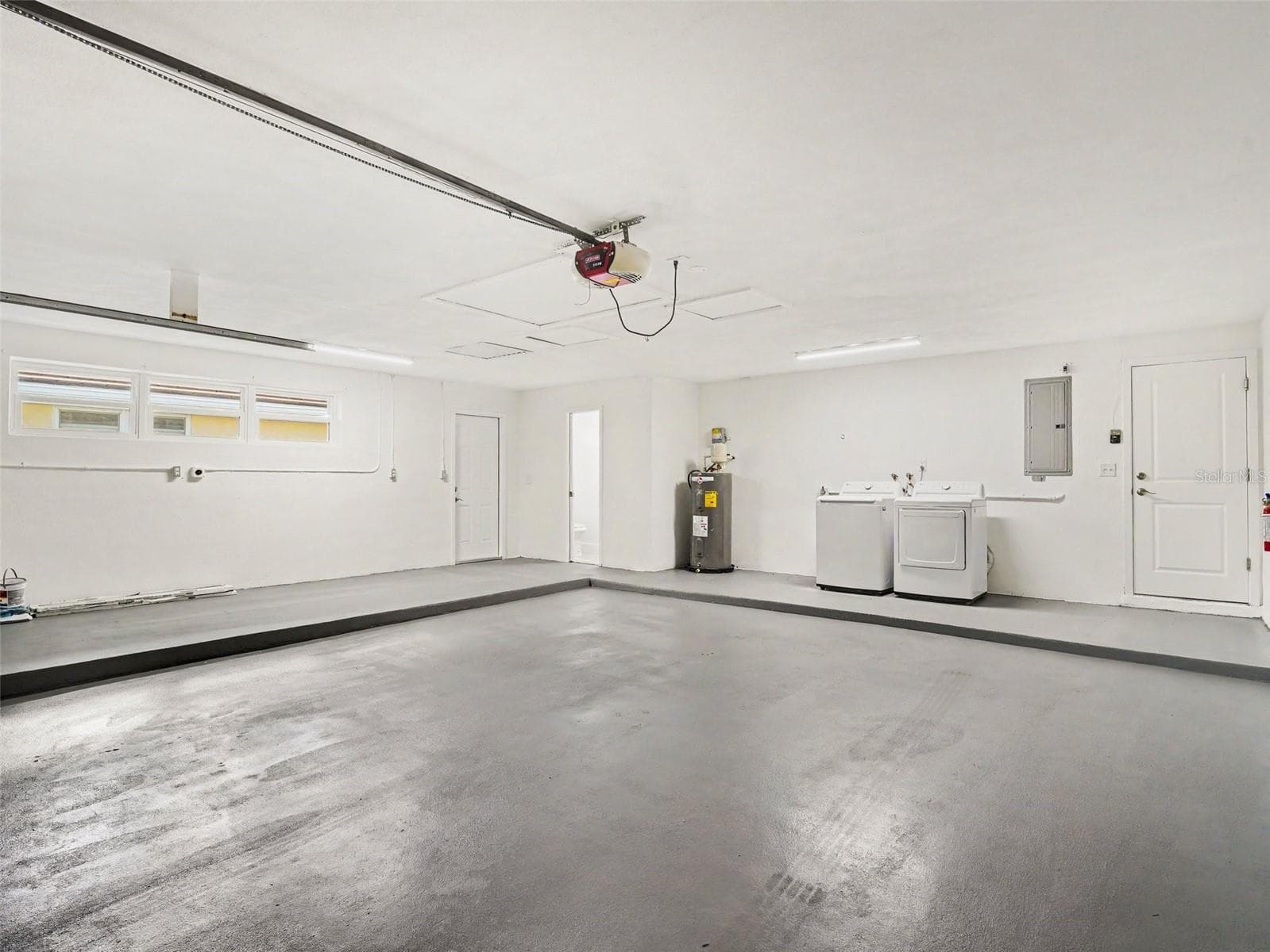 Oversized garage with laundry, 1/2 bath and plenty of room for a workshop - 548 BELVEDERE CT, PUNTA GORDA