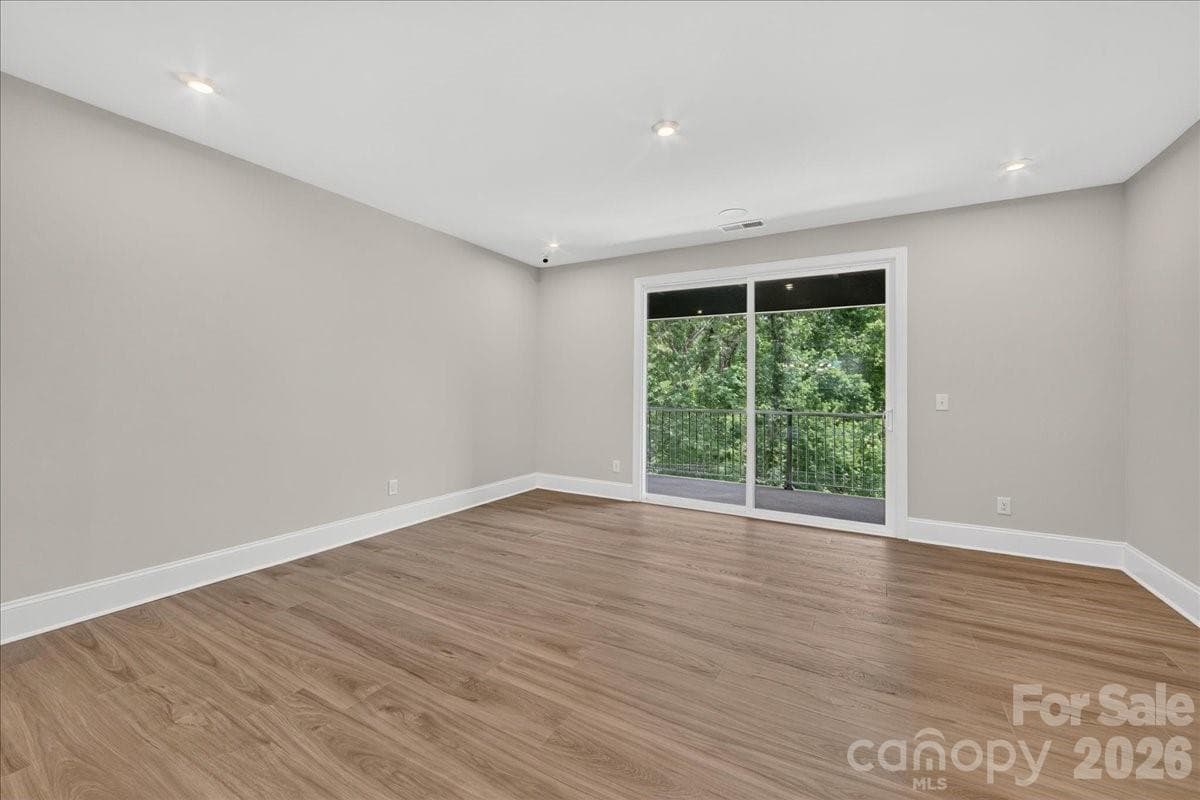 Living room with out door living access - 232 Old Town Village Road, Waxhaw