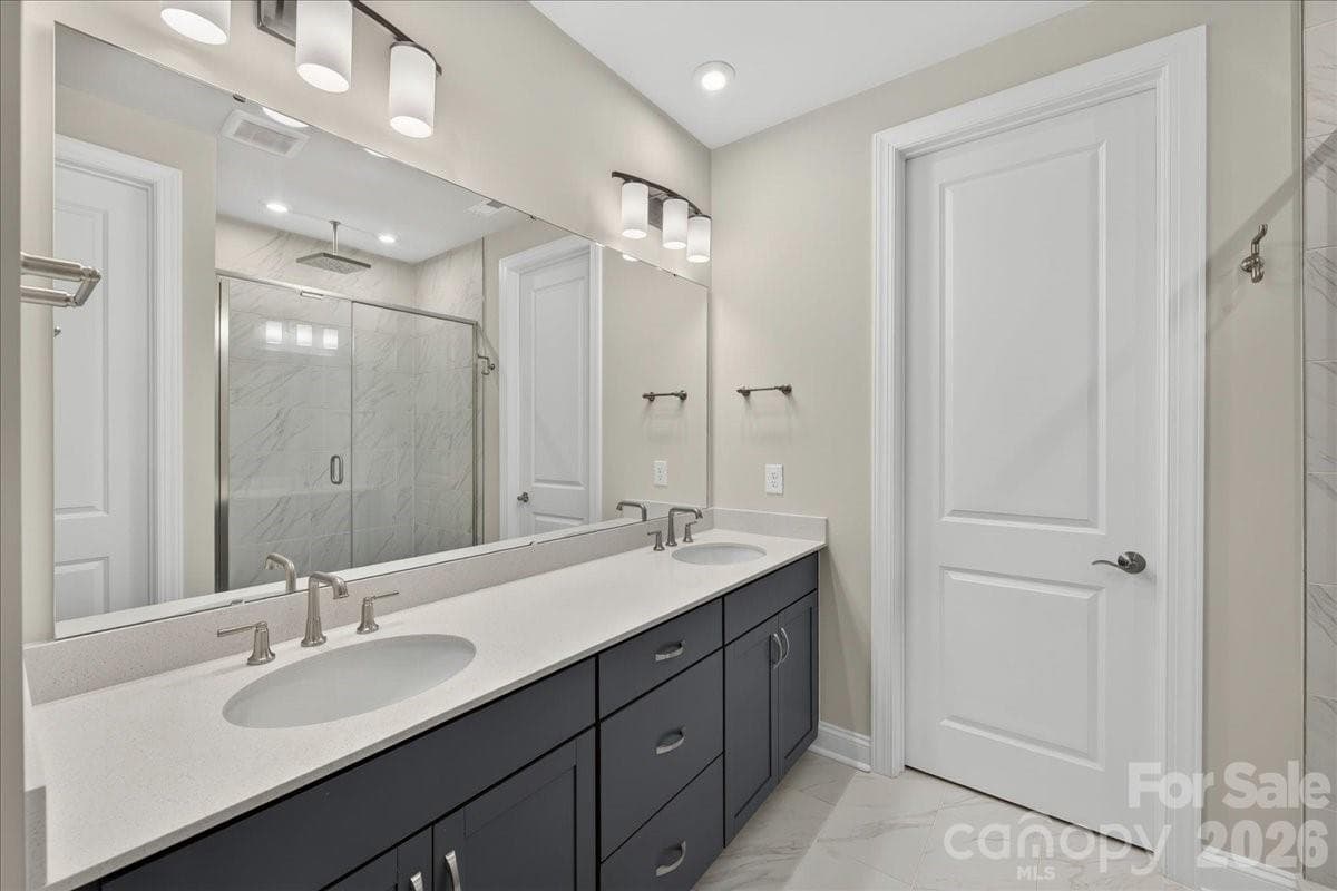 Dual vanity primary bathroom with cabinets with drawers - 232 Old Town Village Road, Waxhaw
