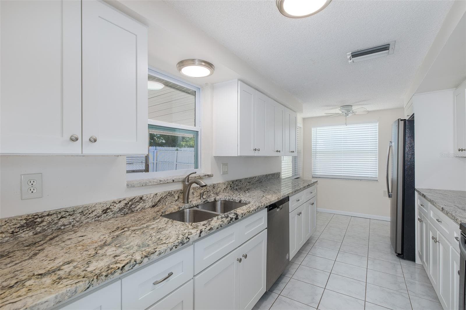 Galley Kitchen with Granite - 1148 FERNWOOD DR, HOLIDAY
