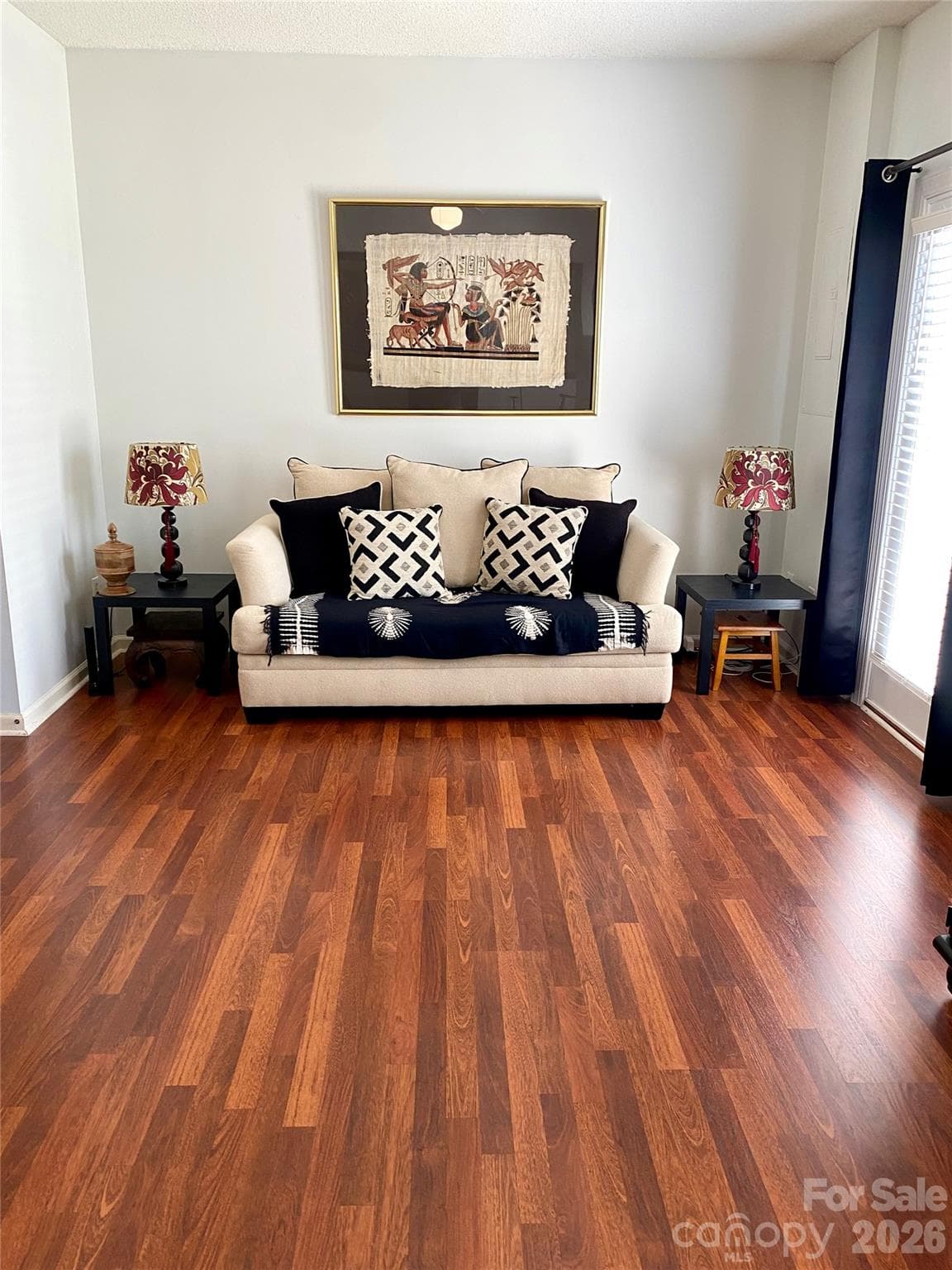Living Room in rear entrance off Patio with laminate wood flooring. - 6025 Creft Circle, Indian Trail