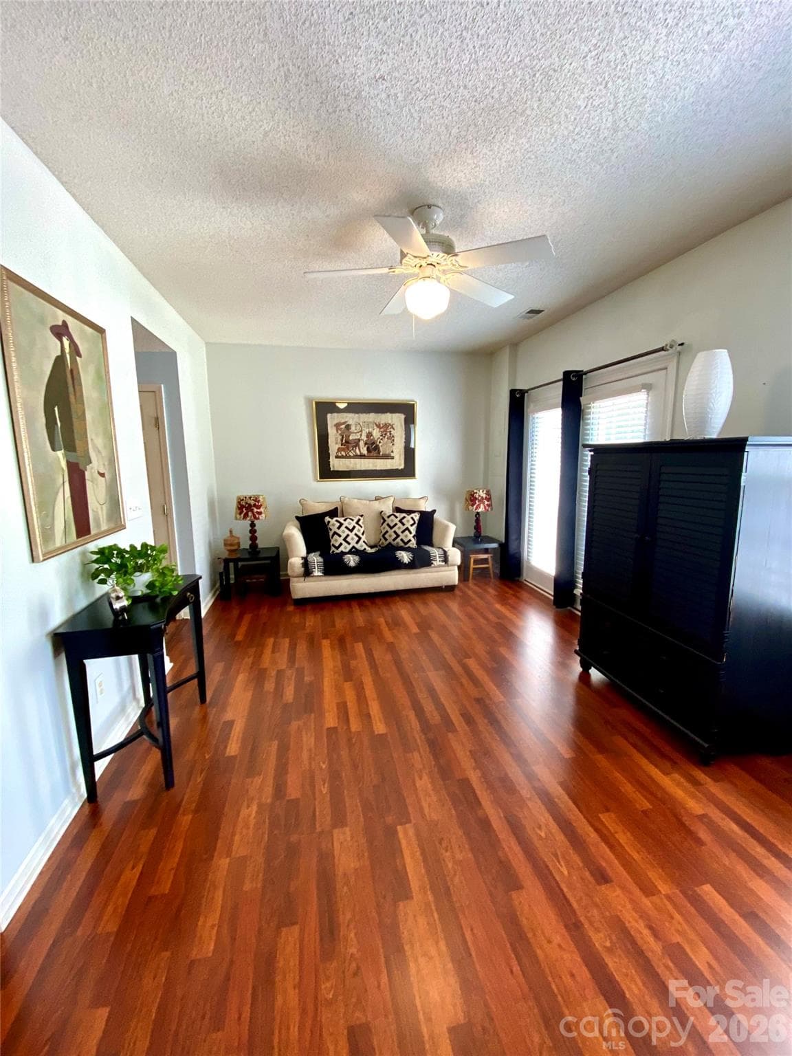 Living Room view near Kitchen area with lots of natural light thru windows facing the rear of the townhome. - 6025 Creft Circle, Indian Trail