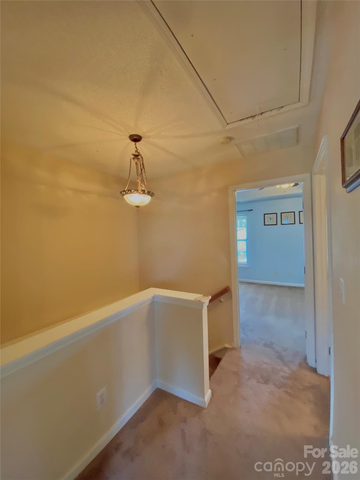 Upstairs hallway with niche area, door to Primary Bedroom. - 6025 Creft Circle, Indian Trail