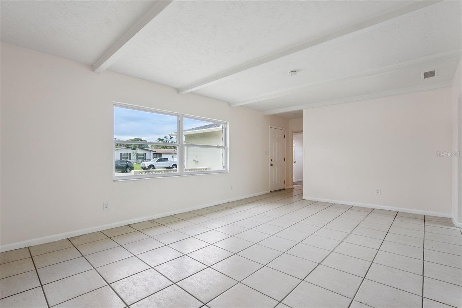 Light-filled Living Room with Tile Floors - 1605 PURITAN AVE, WINTER PARK