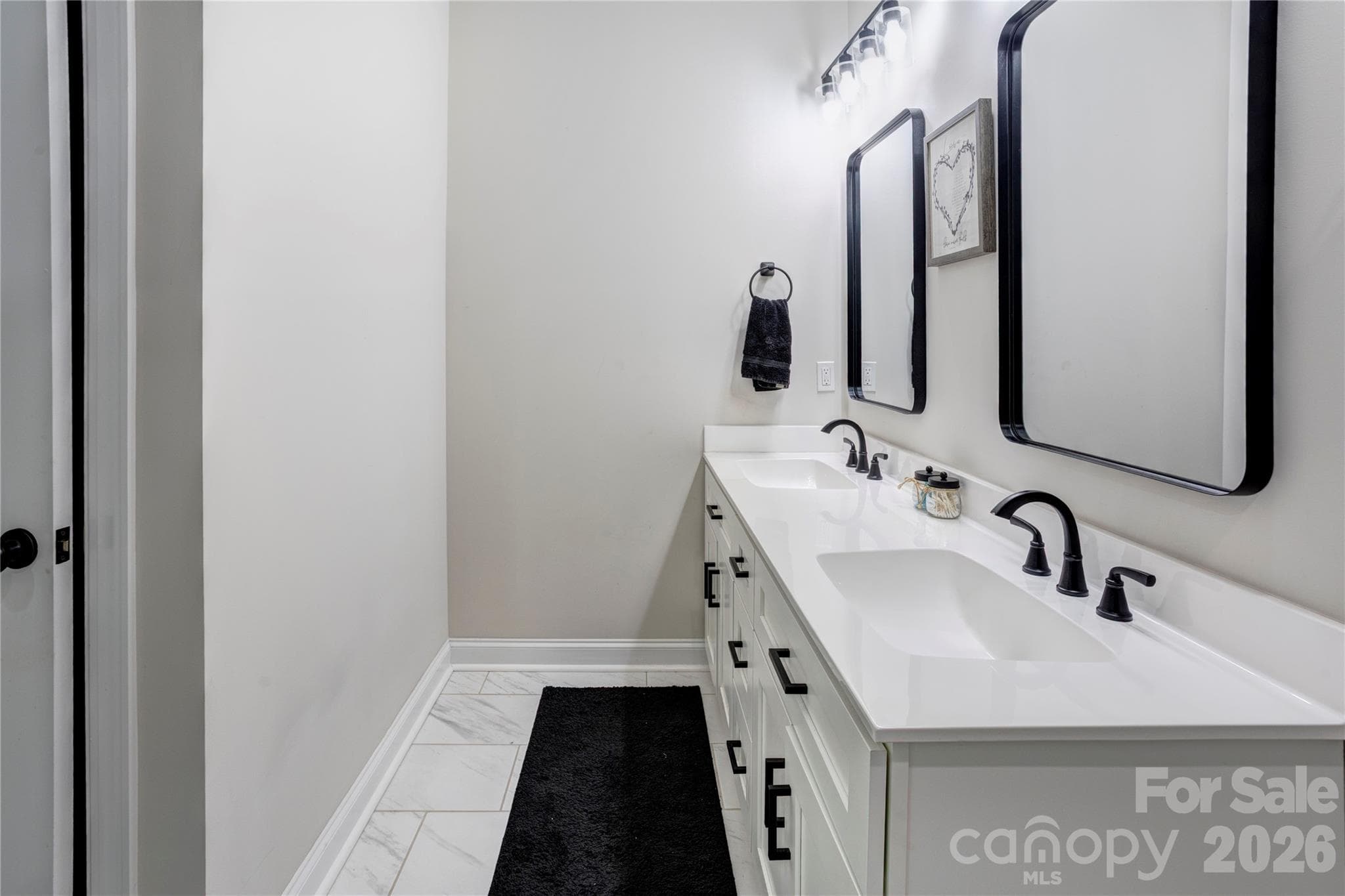 Double vanity in large primary bathroom. - 317 Oak Brook Drive, Salisbury
