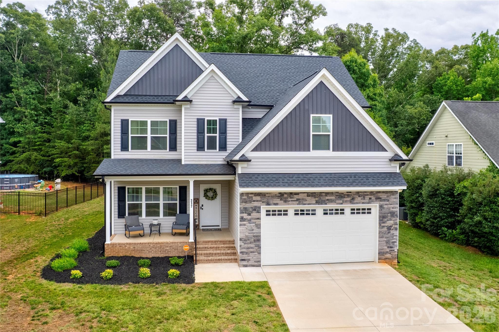 The stone veneer on this home catches your eye as you drive down Oak Brook. - 317 Oak Brook Drive, Salisbury