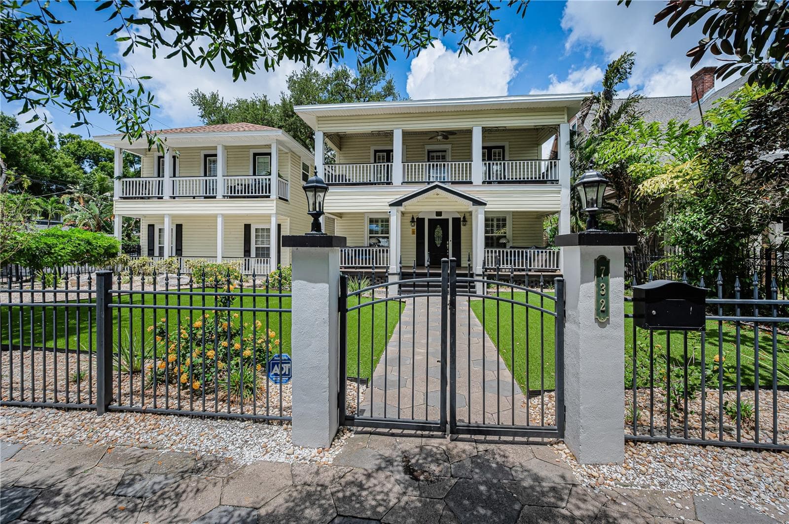Wrought Iron fence surrounding the front lawn. - 732 NE OAK ST, ST PETERSBURG