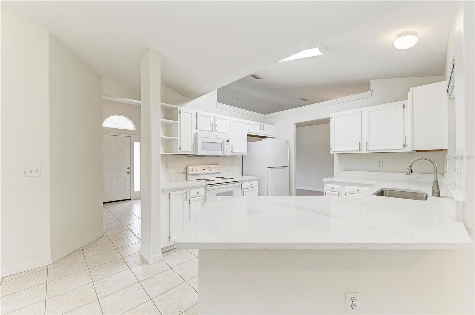 Open kitchen with quartz countertops - 3213 45TH AVE E, BRADENTON