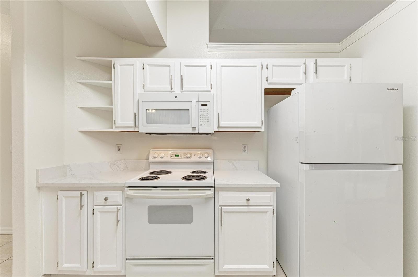 Kitchen with bookshelf - 3213 45TH AVE E, BRADENTON