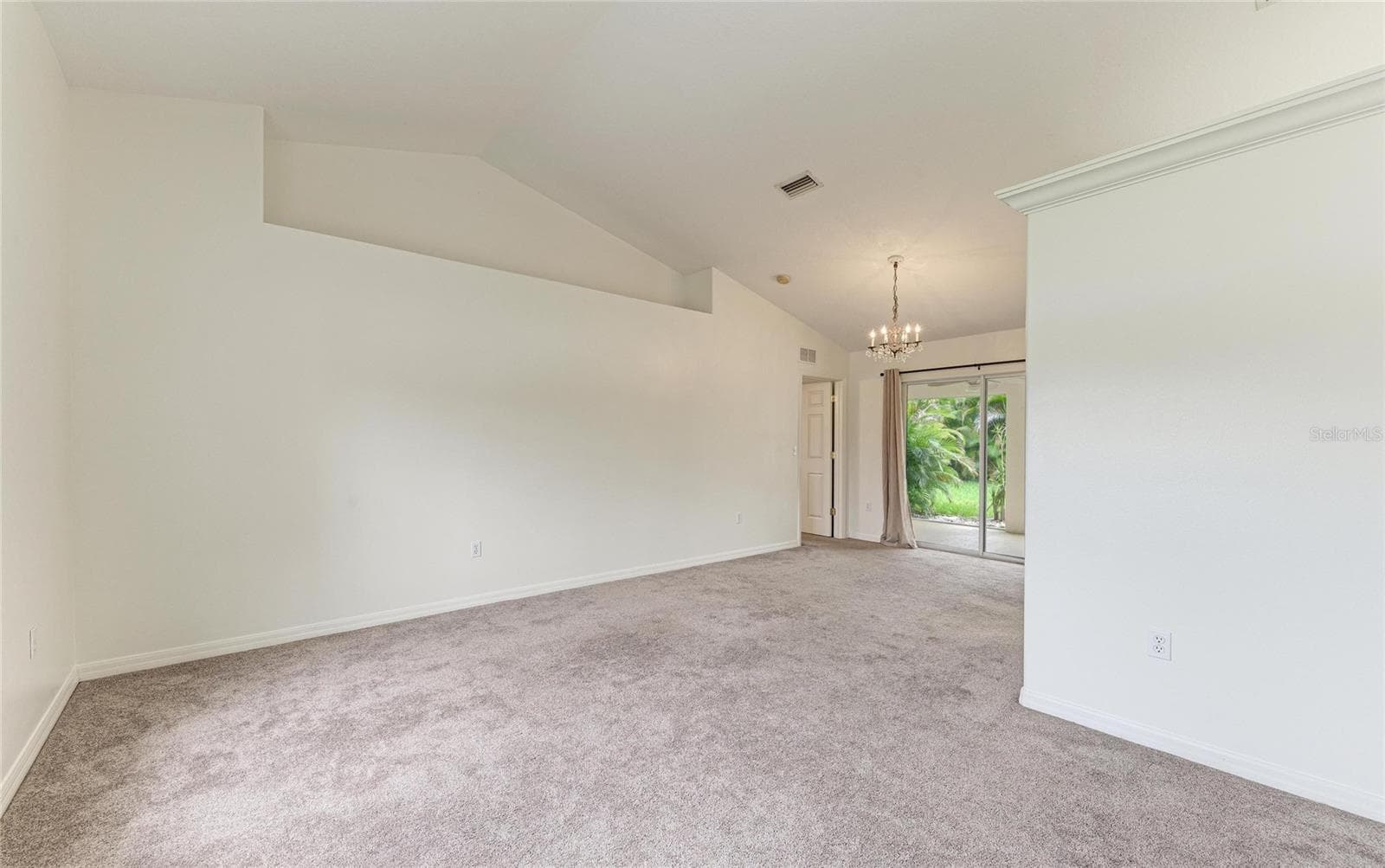 Large living room with plant shelf - 3213 45TH AVE E, BRADENTON