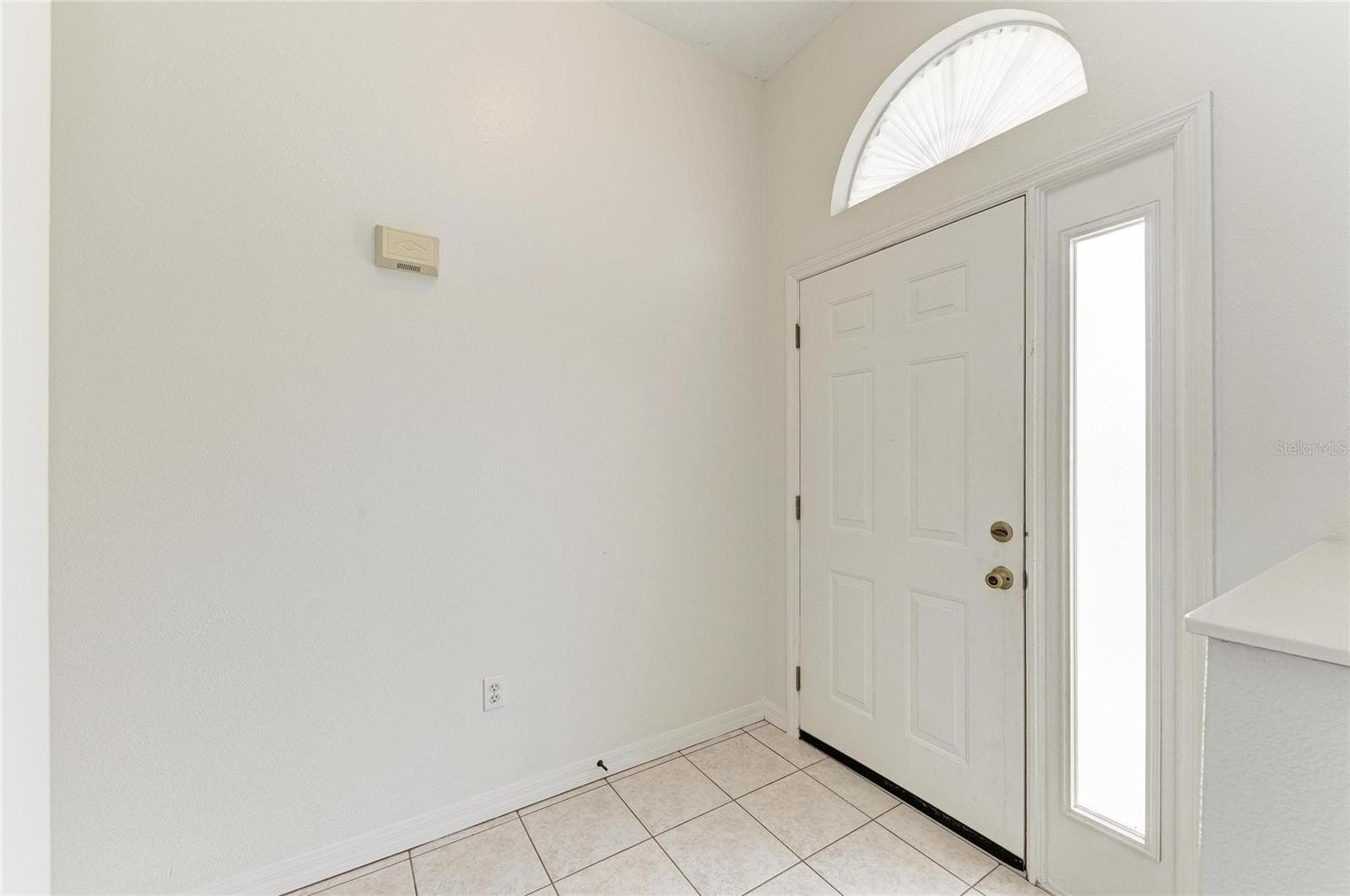 Foyer with transom window and sidelight - 3213 45TH AVE E, BRADENTON