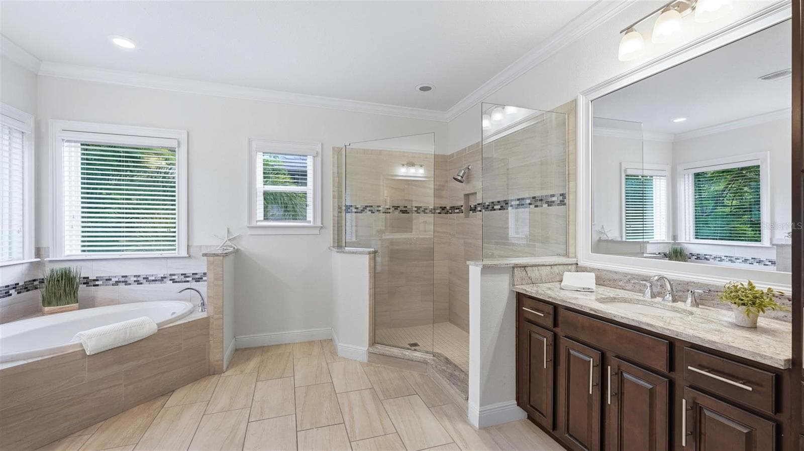 Primary bath with separate vanities, separate shower - 1850 MAGNOLIA ST, SARASOTA