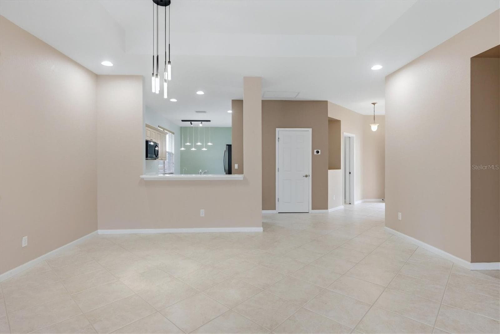 Great Room/Dining Room open to Kitchen - 3275 OSPREY LN, PORT CHARLOTTE