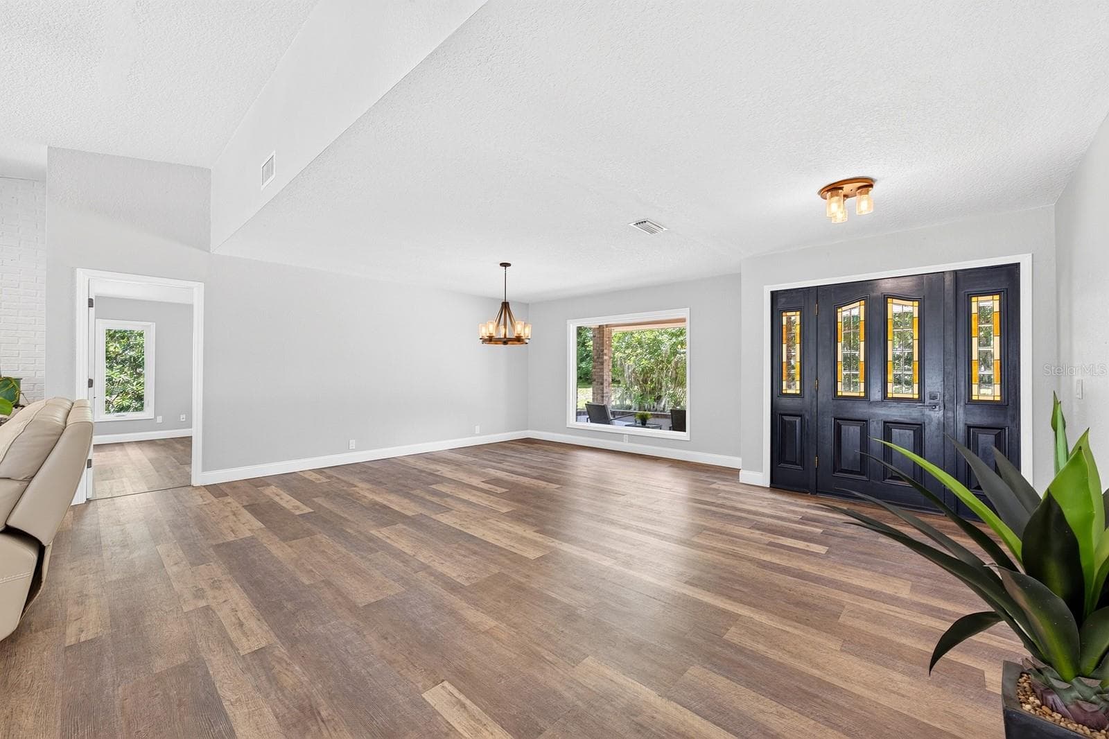 Open living and dining, foyer/front entry. - 1600 E 10TH ST, ST CLOUD