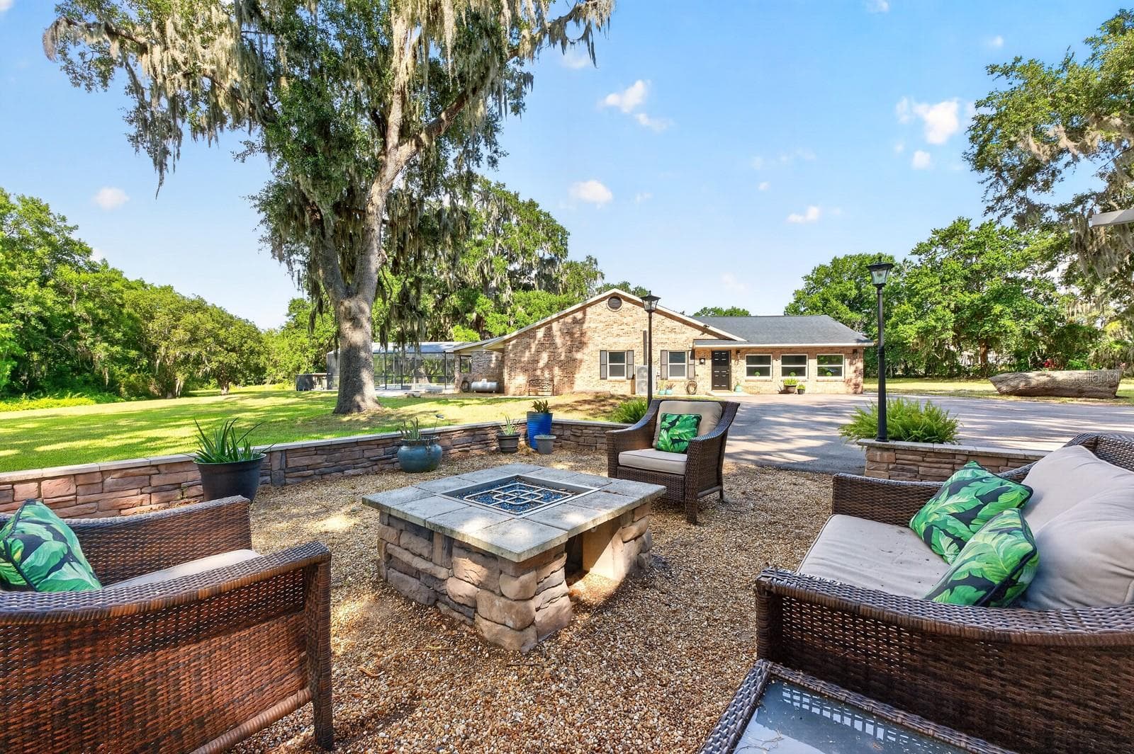 Relax and unwind around the outdoor fireplace. - 1600 E 10TH ST, ST CLOUD