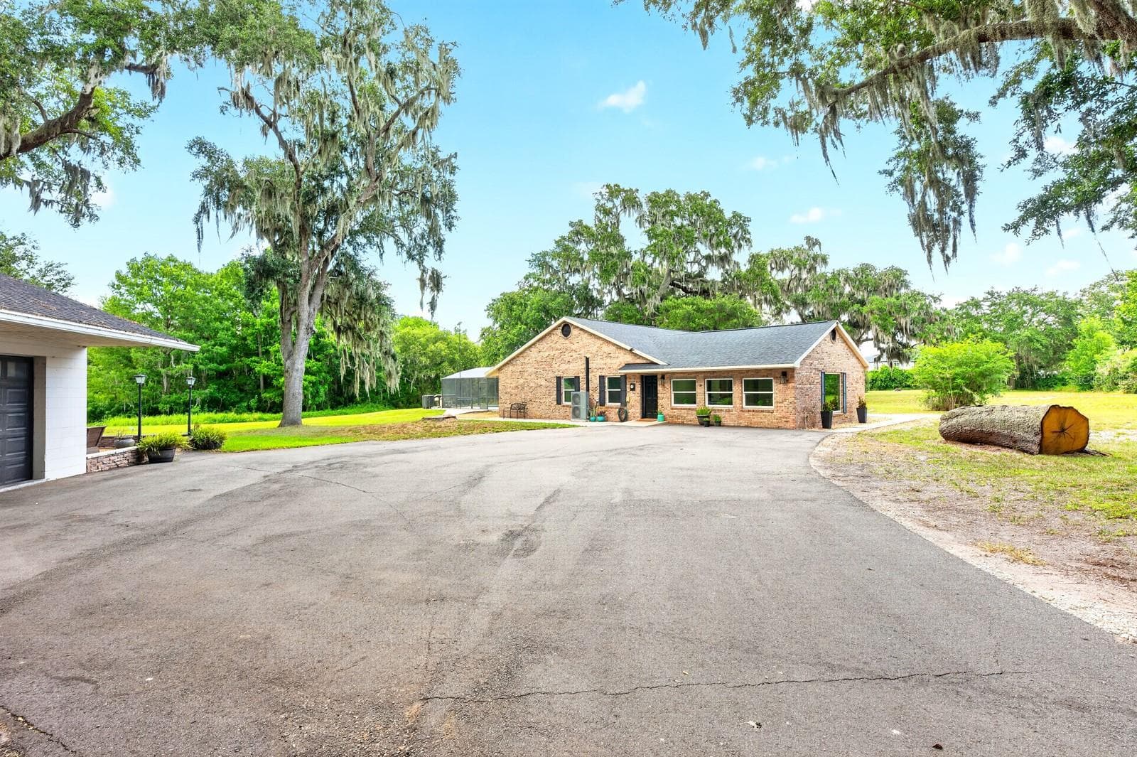 Ample parking between the detached garage and the main home. - 1600 E 10TH ST, ST CLOUD