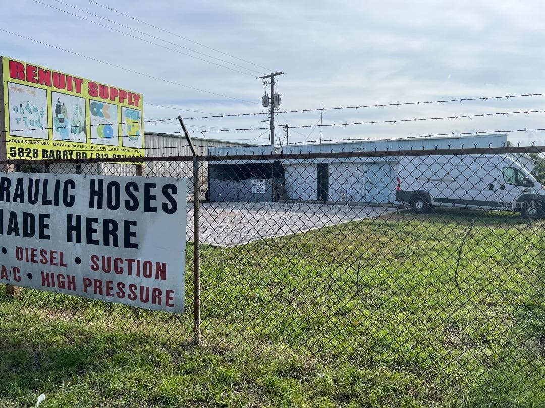 Front with signs - 7810 ANDERSON RD, TAMPA