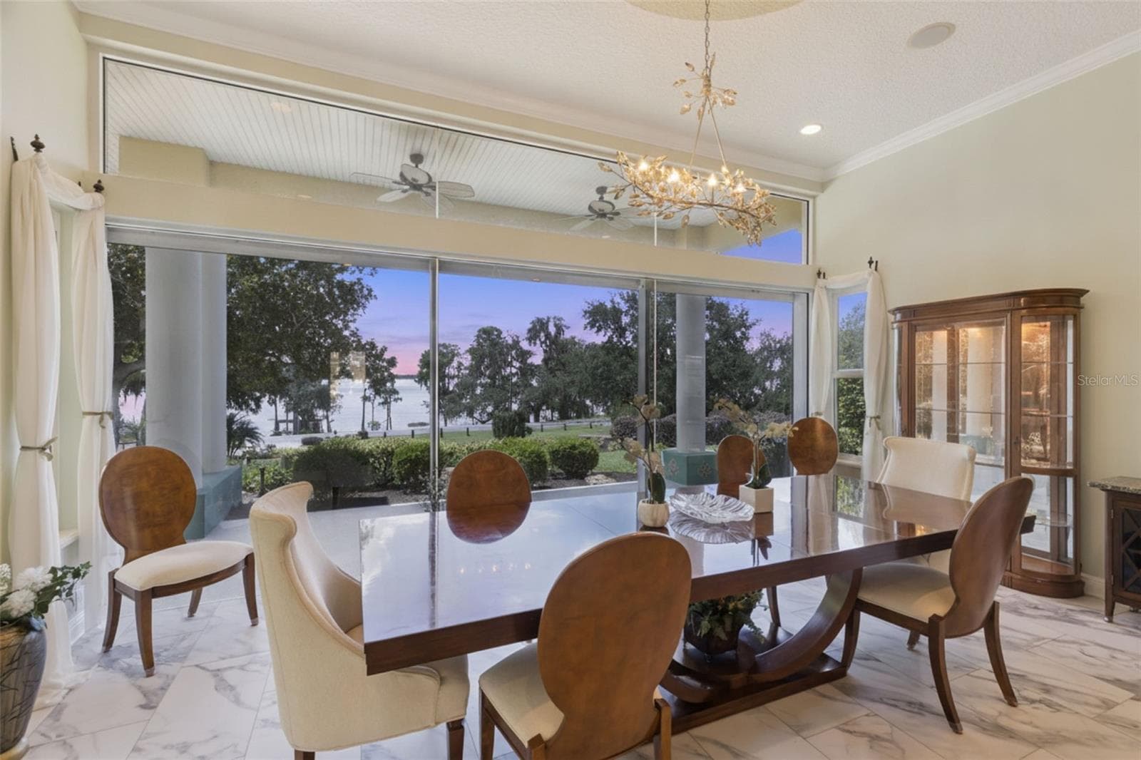 Formal dining room with sunset views - 12128 LAKESHORE DR, CLERMONT