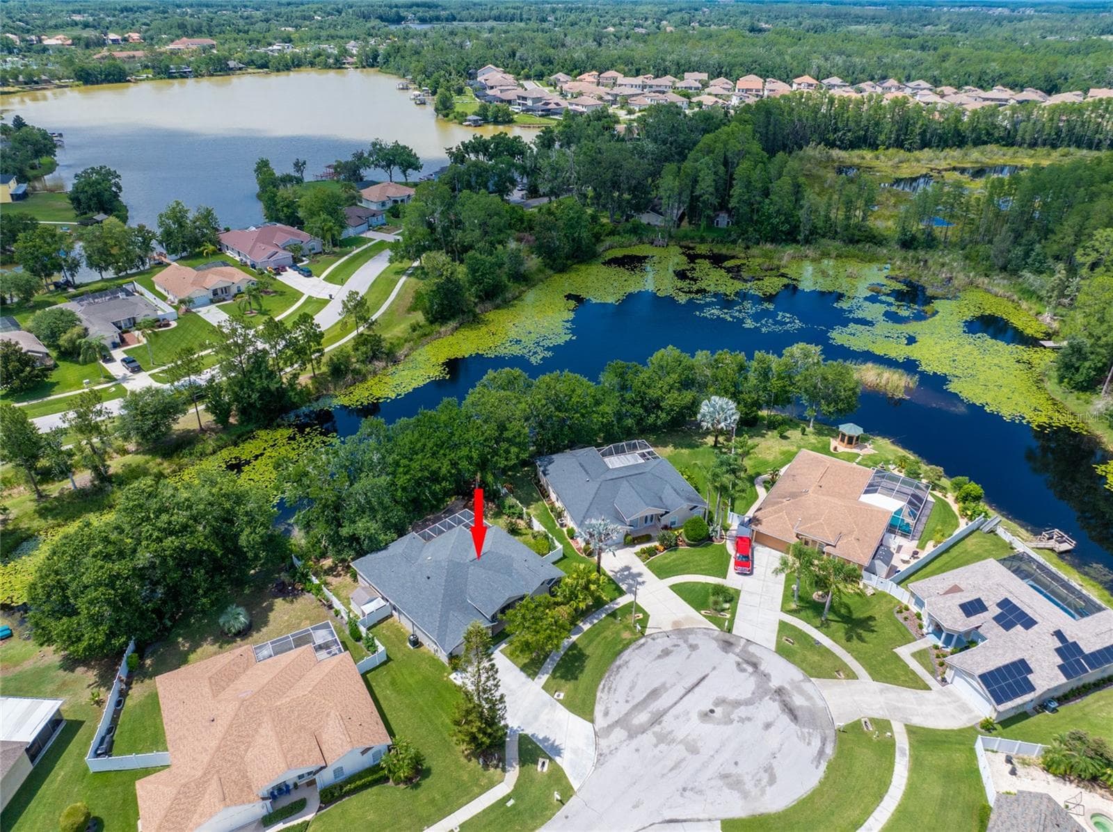 DRONE SHOT OF HOME AND SHOWING LAKE - 21629 SILVER BAY PL, LAND O LAKES