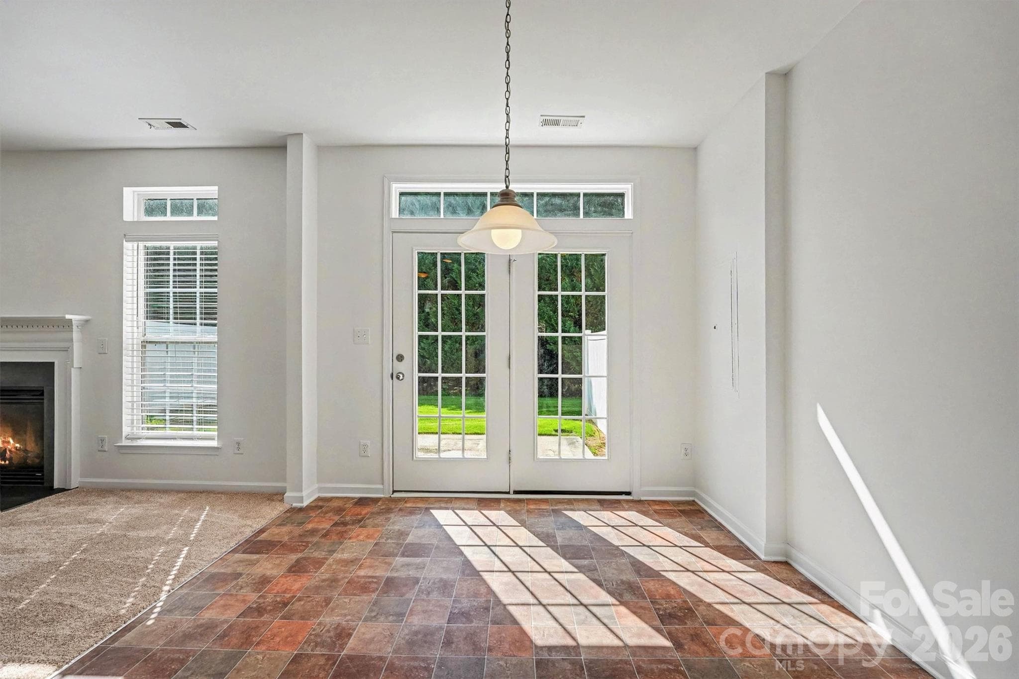Light pours in thru the French doors into the breakfast area - Mooresville