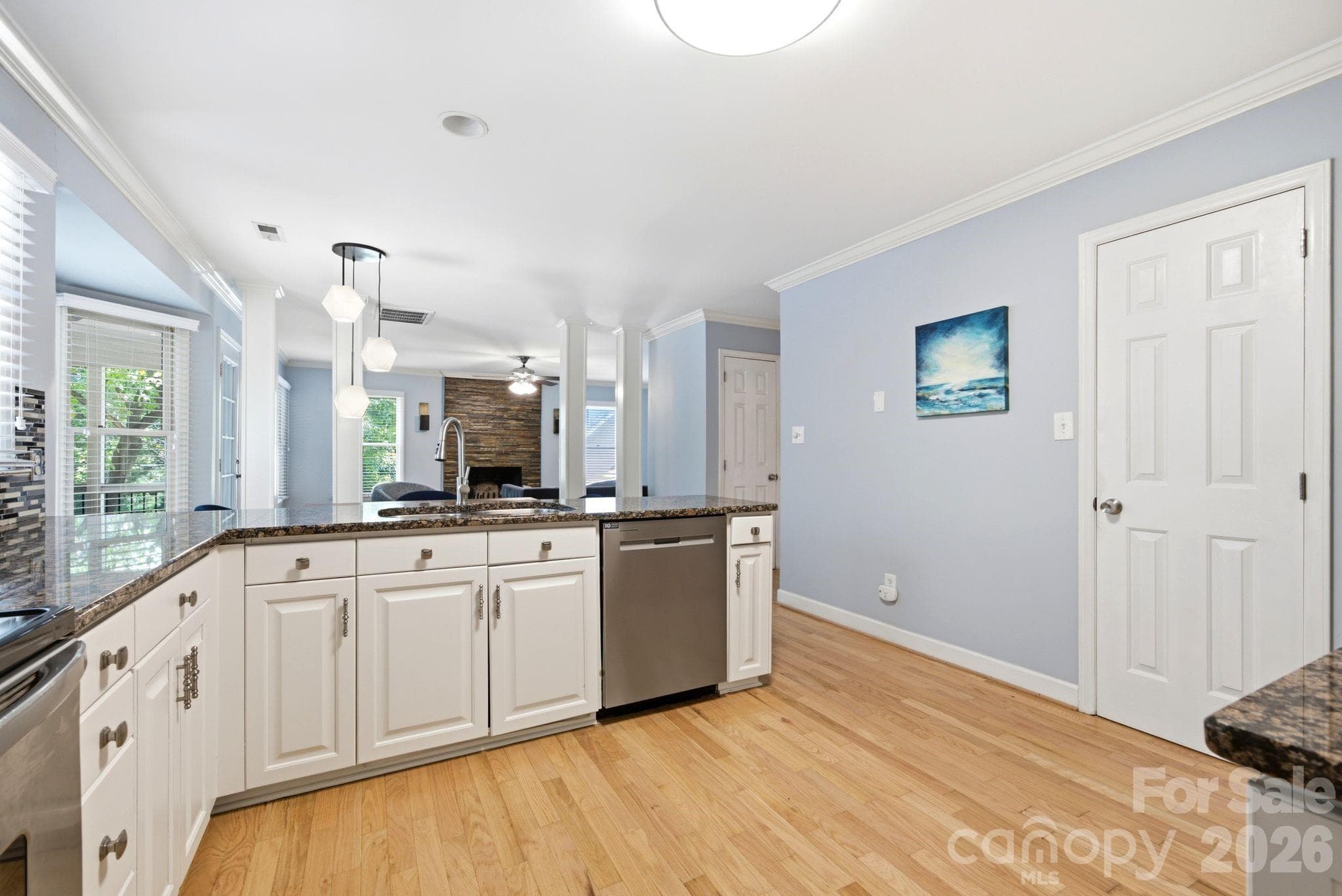 Open-concept kitchen and dining area featuring modern finishes, ample natural light, and space for entertaining. - 503 Wyre Forest Court, Charlotte