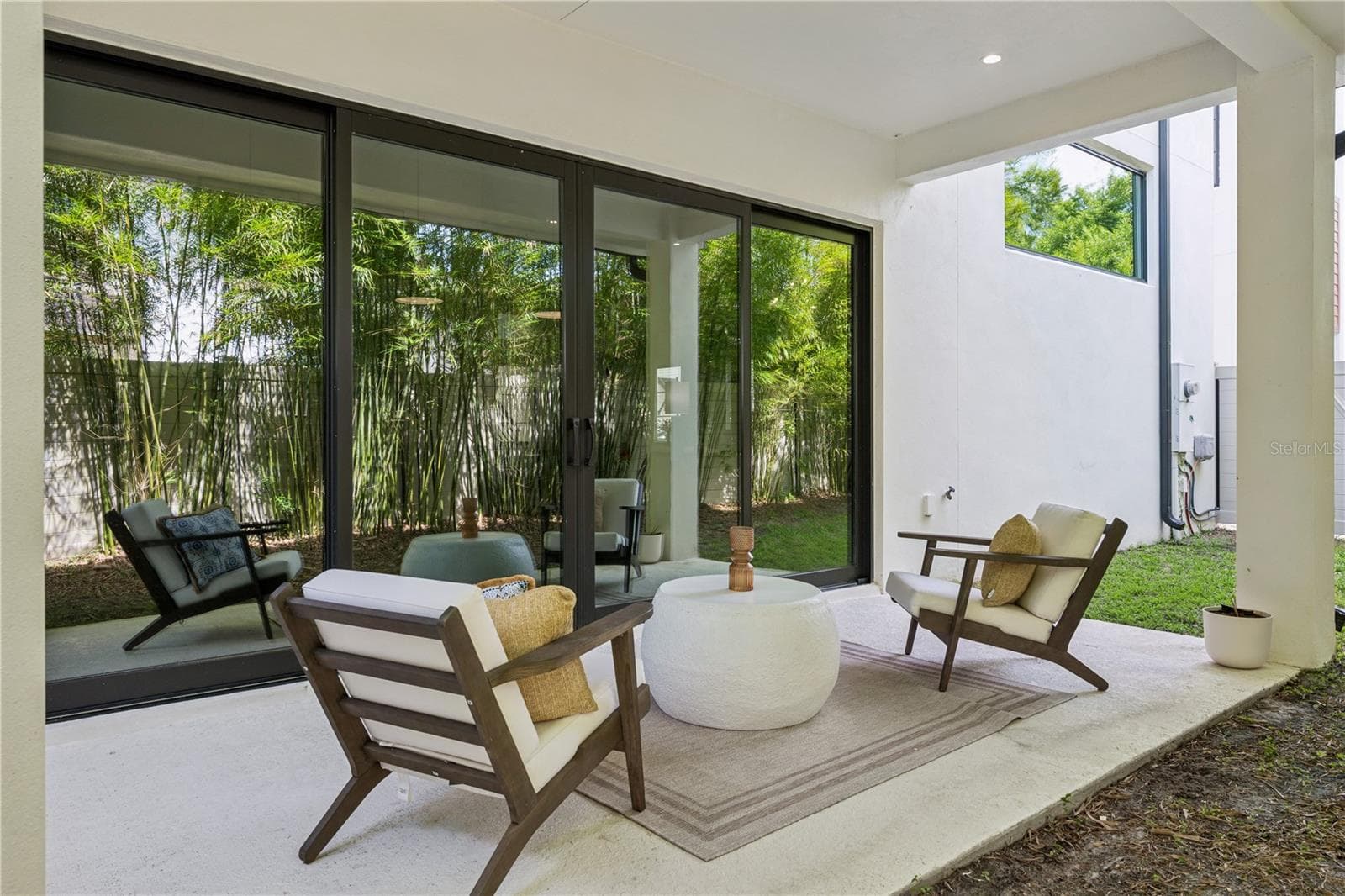 40' x 20' private fenced-in backyard, including a covered patio which extends from the sliding doors. - 512 W SWOOPE AVE, WINTER PARK
