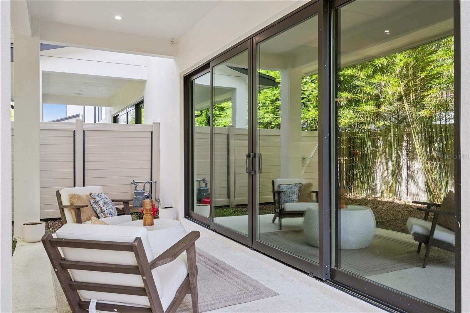 40' x 20' private fenced-in backyard, including a covered patio which extends from the sliding doors. - 512 W SWOOPE AVE, WINTER PARK