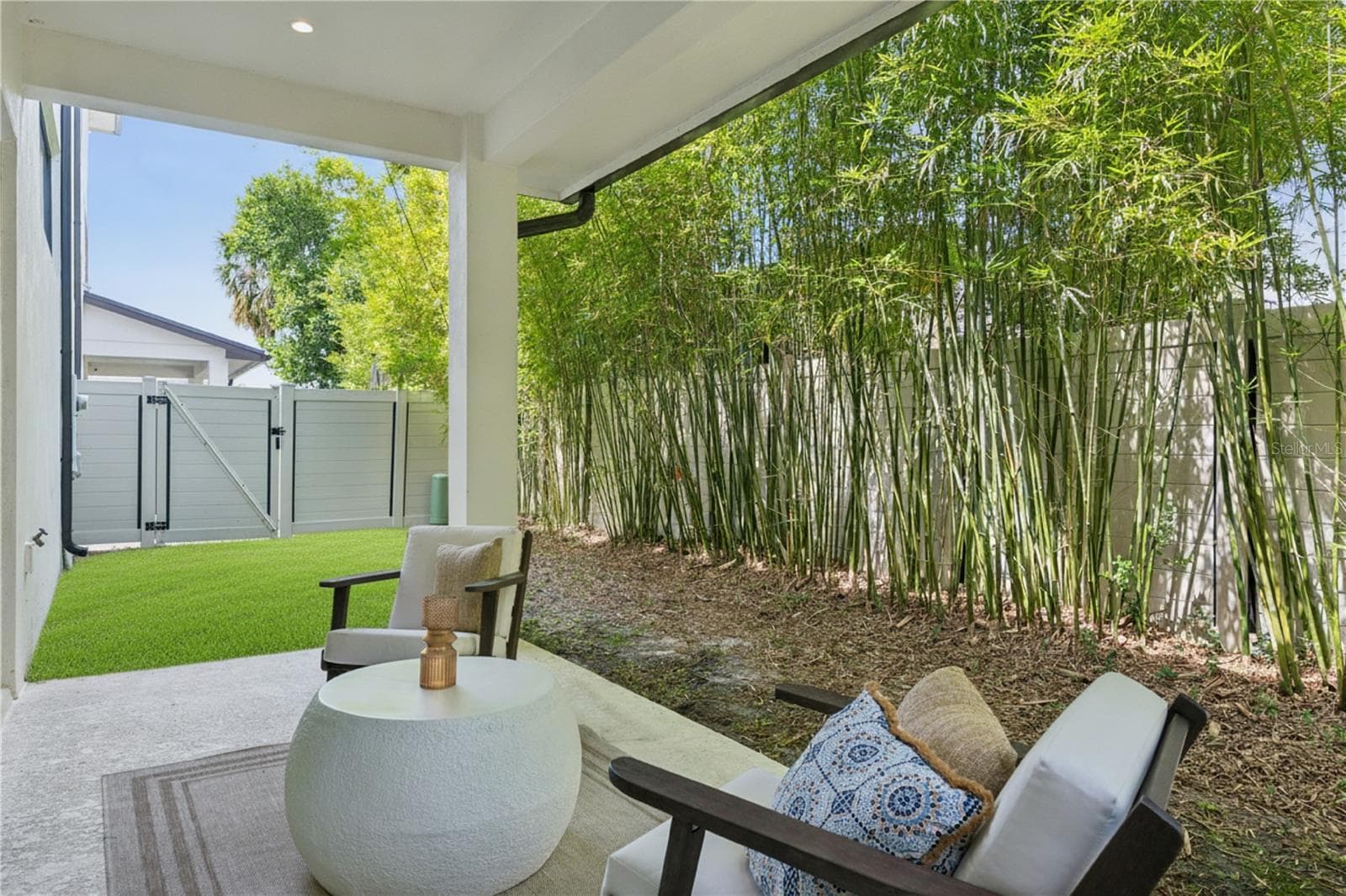 40' x 20' private fenced-in backyard, including a covered patio which extends from the sliding doors. - 512 W SWOOPE AVE, WINTER PARK