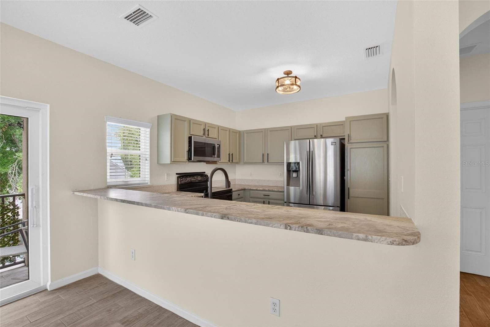 Bar seating area. - 307 SUMMER CLOUDS PL, BRANDON
