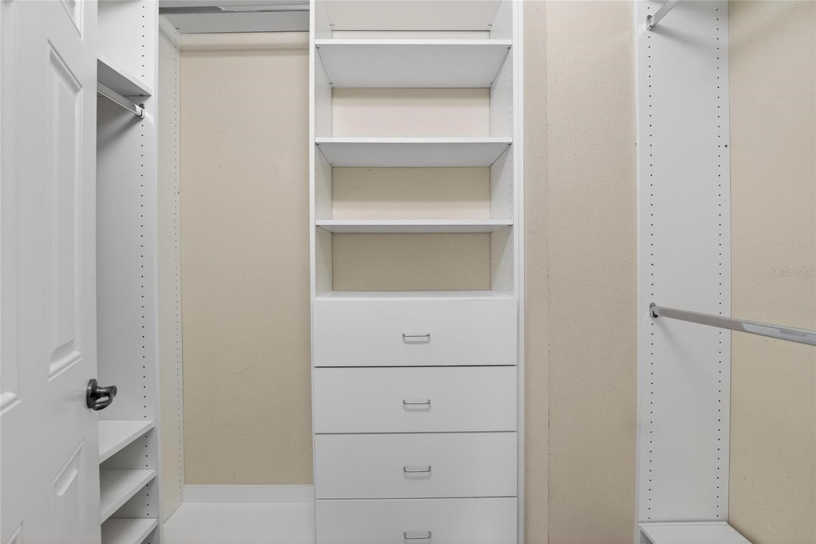 Primary bedroom closet with built ins. - 307 SUMMER CLOUDS PL, BRANDON