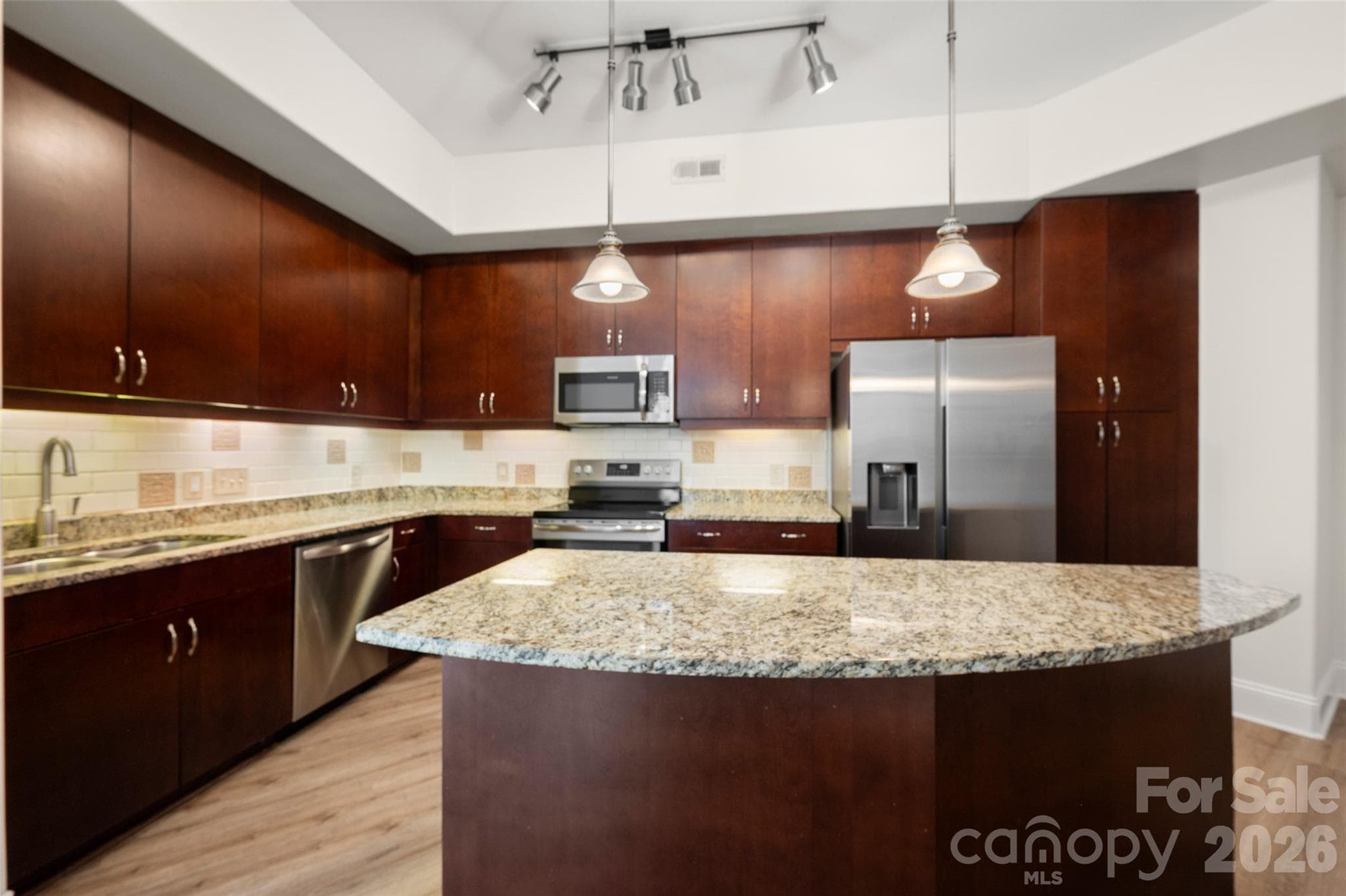 Large kitchen with newer stainless steel appliances. - Charlotte