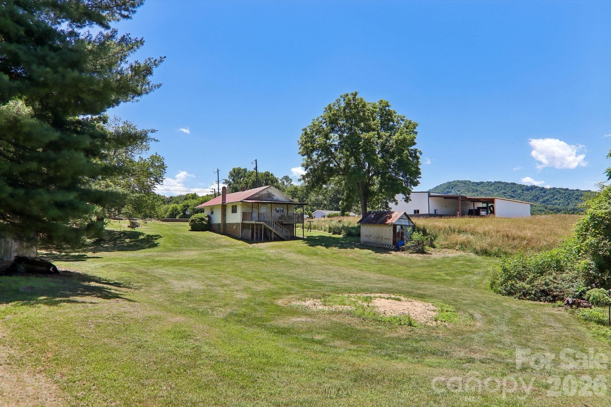 Lot is .43 acres. Garden space, blackberries. Use the land or divide off extra lot which is allowed per town of Canton zoning - Canton