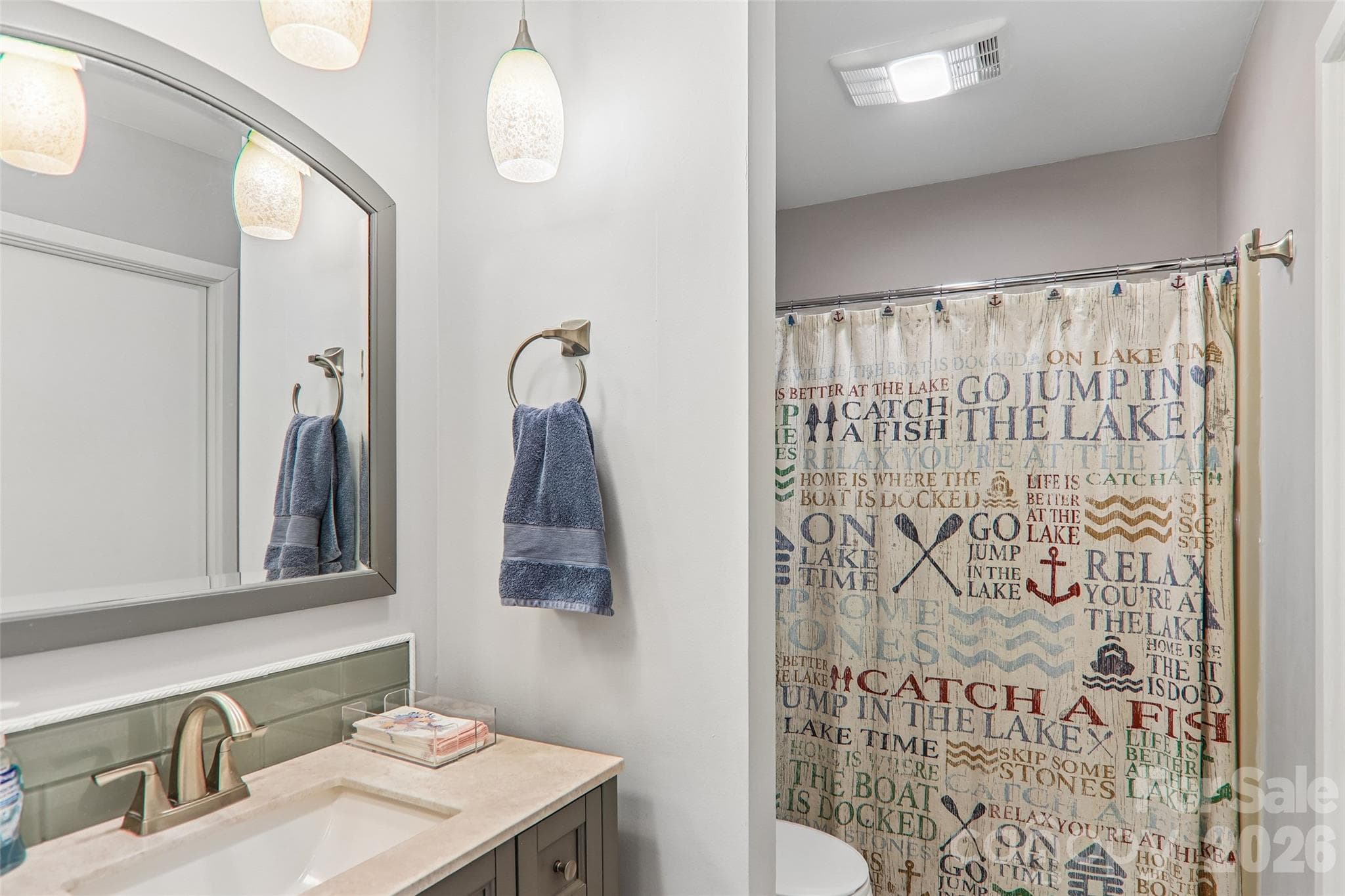 Updated bathrooms with new fixtures - 147 W Lake Drive S, Lake Lure