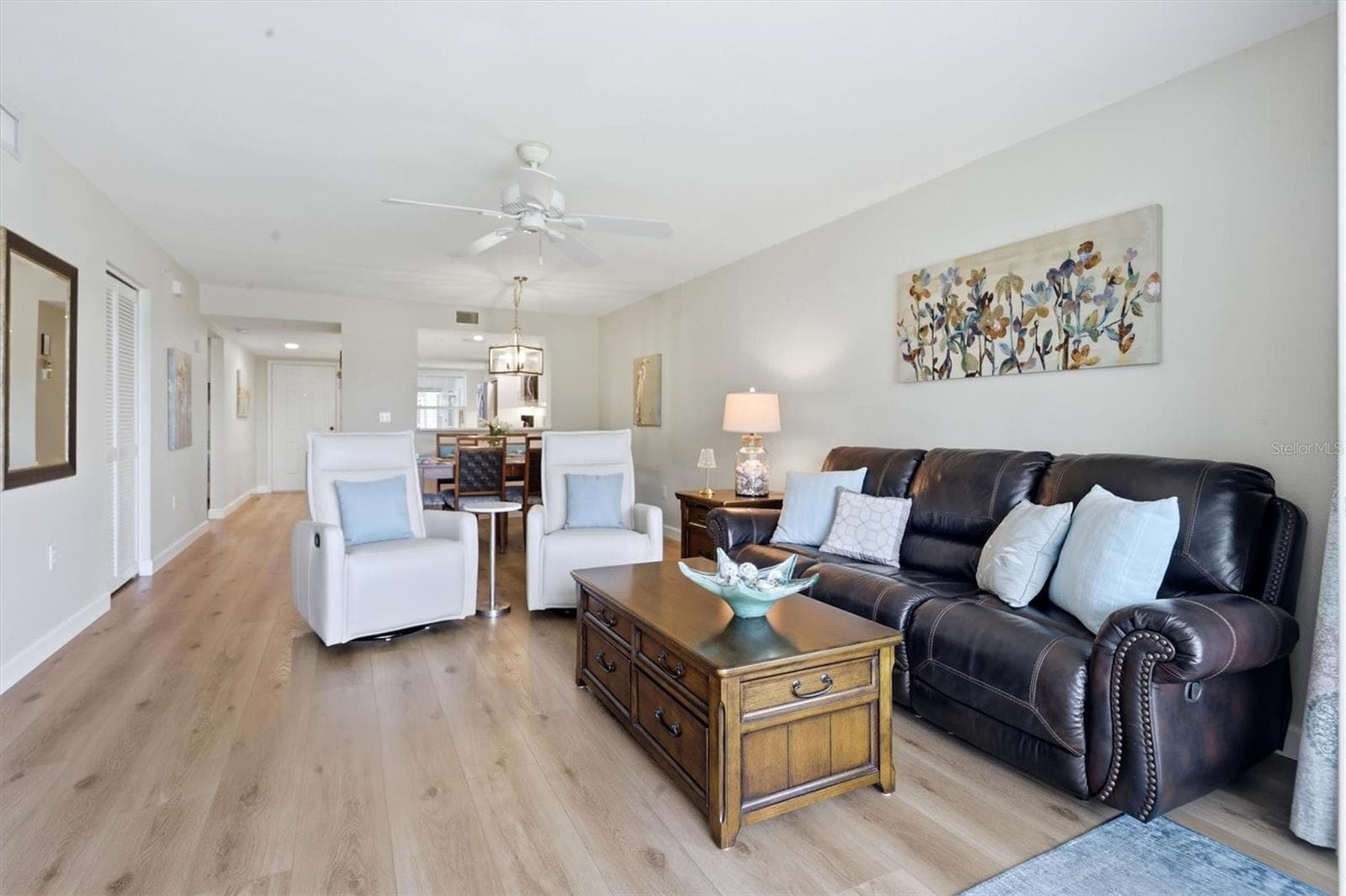 Living room with dining room behind - 9320 CLUBSIDE CIR #2209, SARASOTA