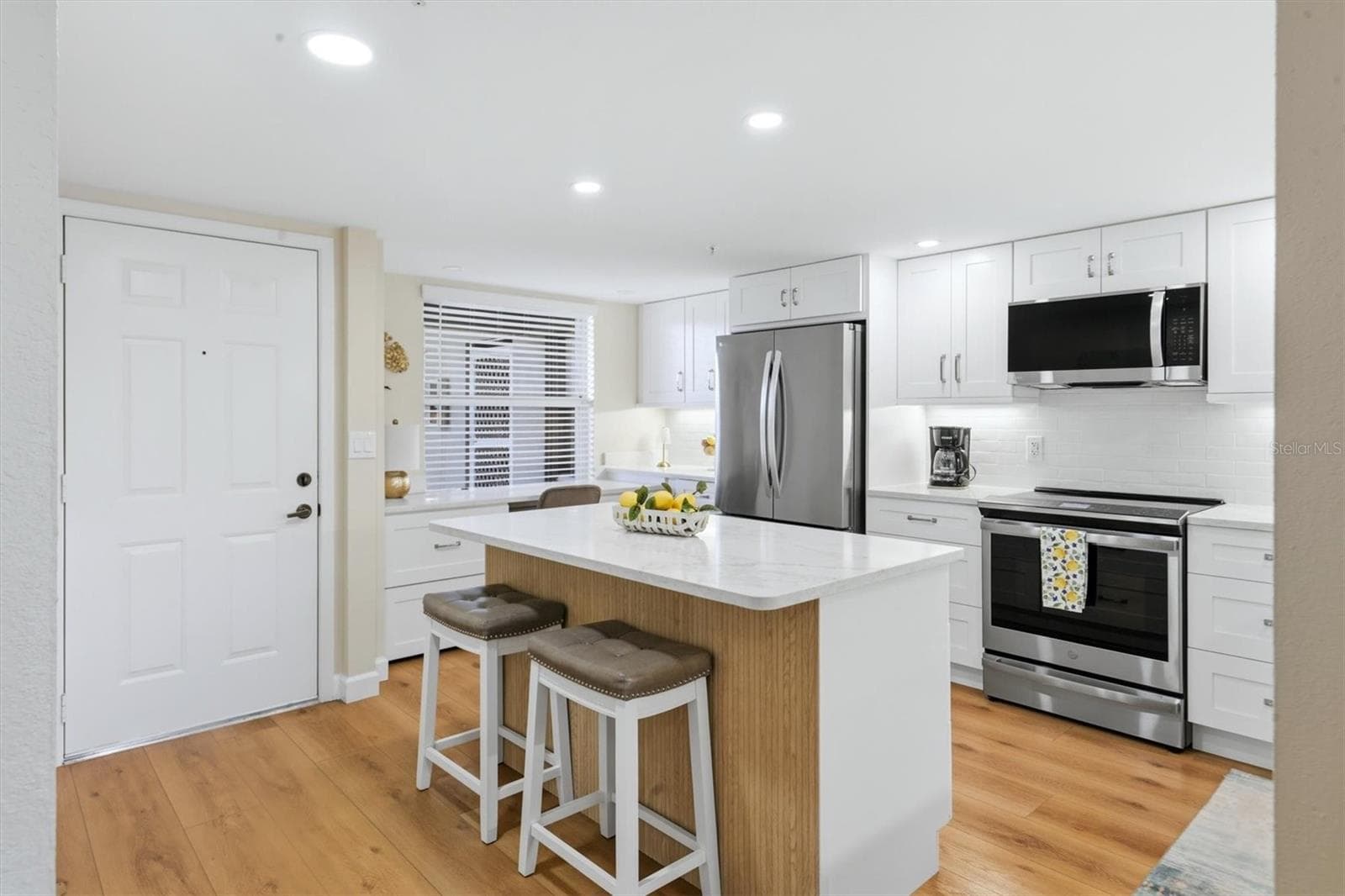Kitchen island and cabinets - 9320 CLUBSIDE CIR #2209, SARASOTA