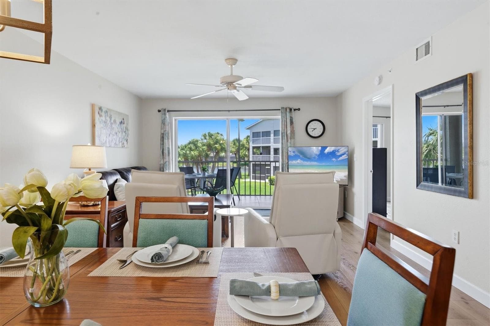 Dining/living room with lanai in the background - 9320 CLUBSIDE CIR #2209, SARASOTA