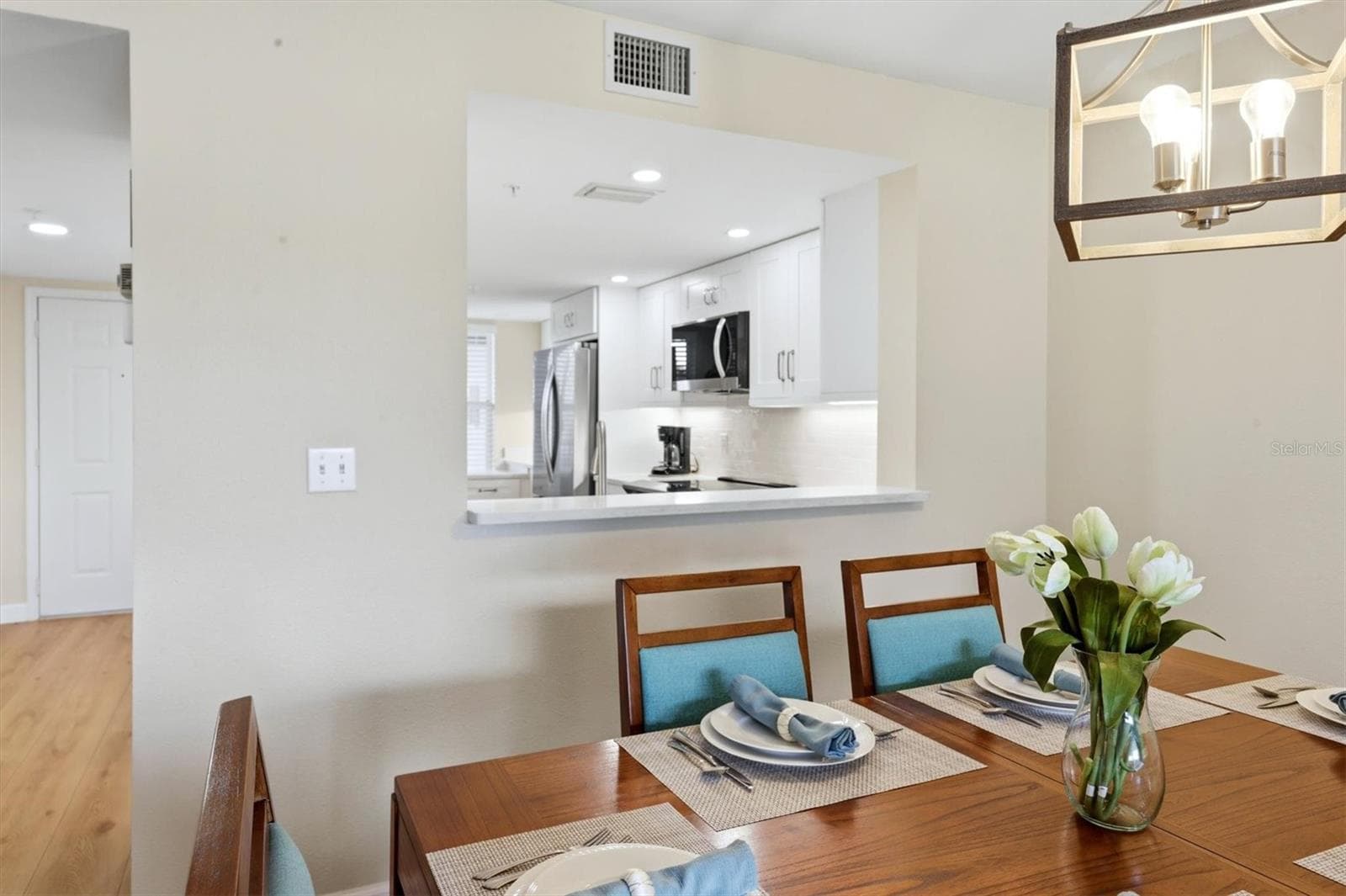Dining room with pass through to the kitchen - 9320 CLUBSIDE CIR #2209, SARASOTA