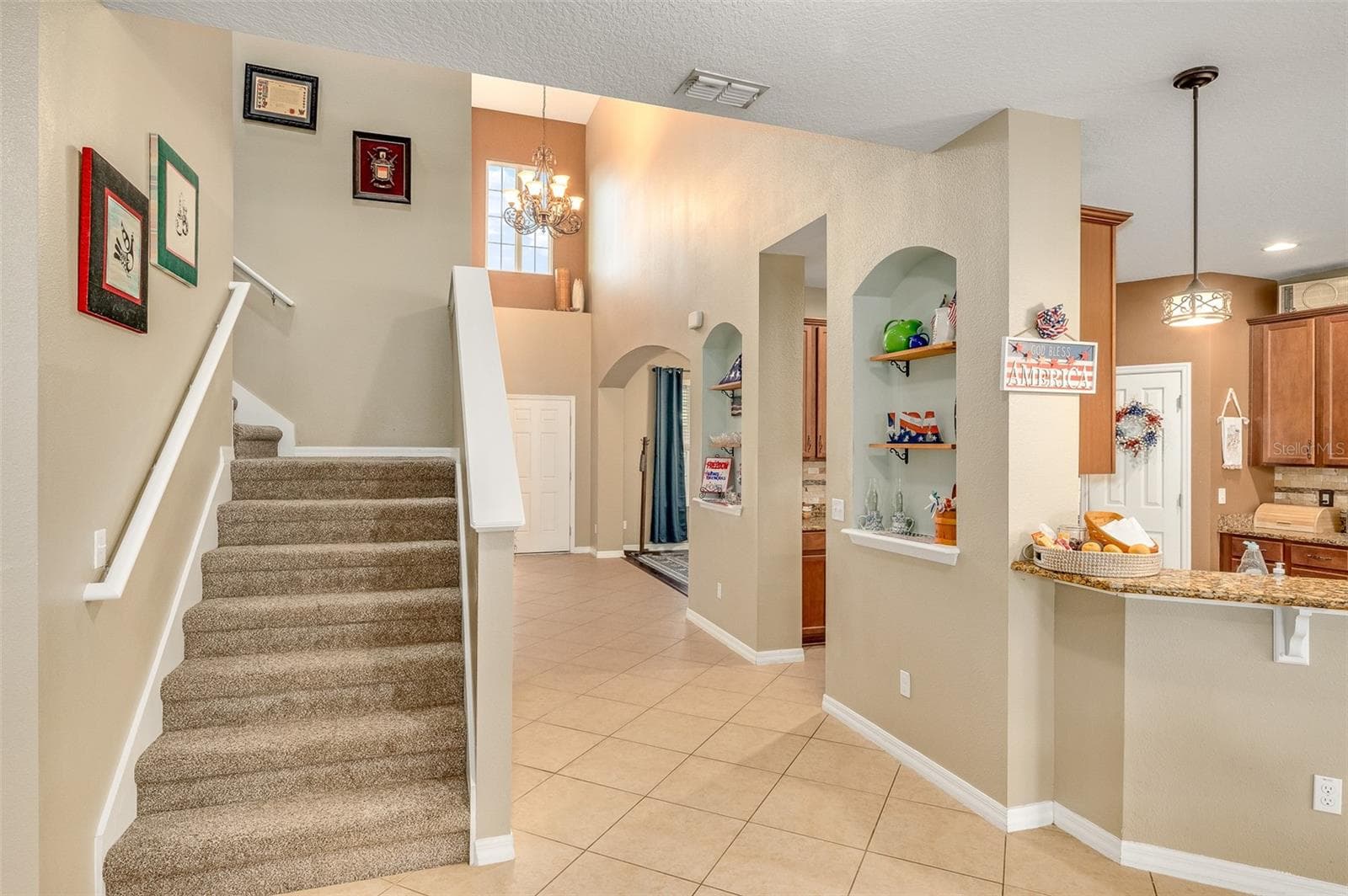 When exiting downstairs primary bedroom, staircase is on the left - 2711 CYPRESS TREE TRL, ST CLOUD